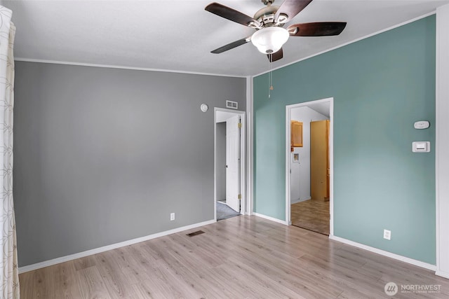 700 N Reed St Unit 101, Sedro Woolley, WA 98284 - unfurnished bedroom with wood finished floors, ornamental molding, a ceiling fan, and vaulted ceiling
