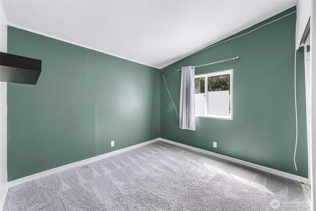 700 N Reed St Unit 101, Sedro Woolley, WA 98284 - unfurnished room with carpet floors and vaulted ceiling