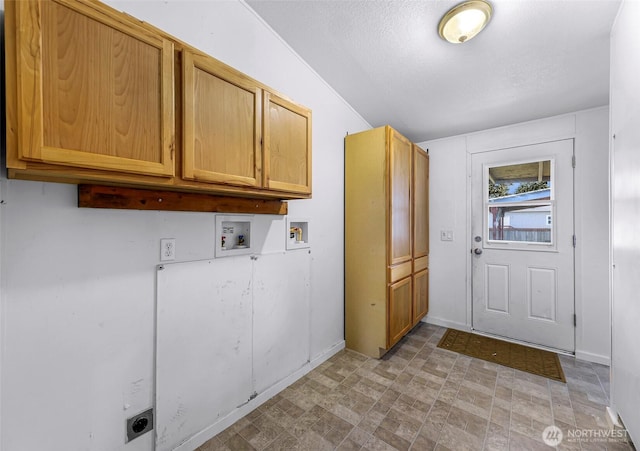 700 N Reed St Unit 101, Sedro Woolley, WA 98284 - washroom featuring electric dryer hookup, cabinet space, and washer hookup