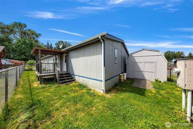 700 N Reed St Unit 101, Sedro Woolley, WA 98284 - view of home's exterior featuring a storage shed and a deck