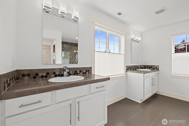 424 3rd Ln S Unit 12, Kirkland, WA 98033 - full bath with two vanities, tile patterned flooring, and tiled shower
