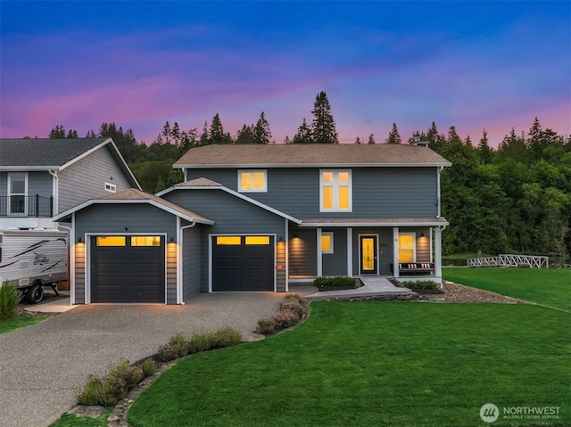 493 N Beach Dr, Port Ludlow, WA 98365 - view of front of home with a garage, covered porch, a front yard, and driveway