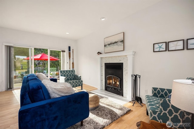 493 N Beach Dr, Port Ludlow, WA 98365 - living area featuring a premium fireplace, light wood-style floors, and recessed lighting