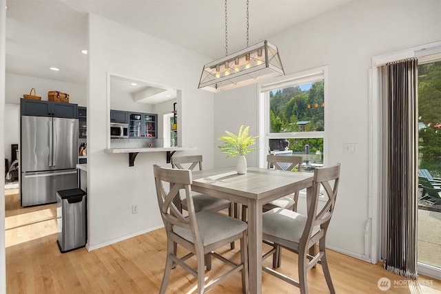 493 N Beach Dr, Port Ludlow, WA 98365 - dining area with light wood finished floors and recessed lighting