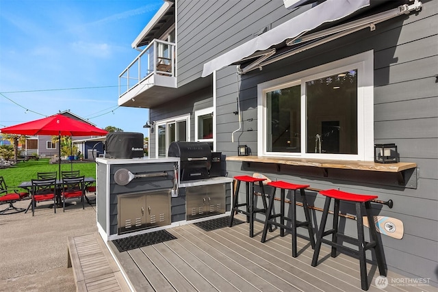 493 N Beach Dr, Port Ludlow, WA 98365 - deck with grilling area, a patio, and outdoor dining space