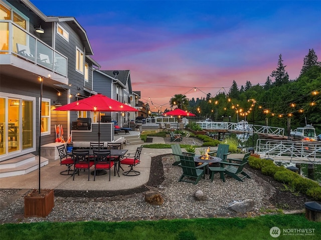 493 N Beach Dr, Port Ludlow, WA 98365 - view of yard featuring an outdoor fire pit and a patio area