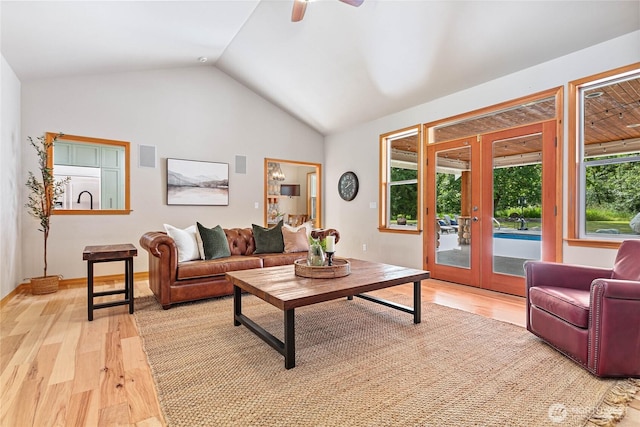 6068 E Hemmi Ln, Bellingham, WA 98226 - living area featuring light wood-style floors, vaulted ceiling, french doors, and a ceiling fan