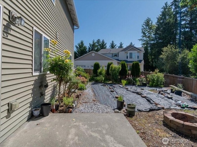 7335 33rd Ave NE, Lacey, WA 98516 - fenced backyard with a patio area and a fire pit