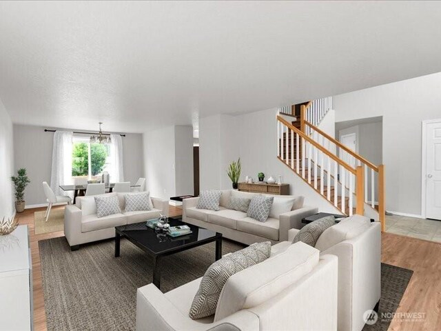 7335 33rd Ave NE, Lacey, WA 98516 - living room with stairway, light wood-type flooring, and a chandelier