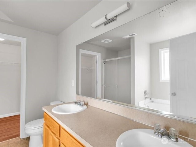 7335 33rd Ave NE, Lacey, WA 98516 - bathroom featuring a stall shower, a spacious closet, a garden tub, and double vanity
