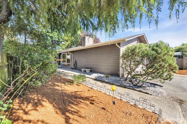 1229 SW 146th, Seahurst, WA 98168 - view of side of property featuring a chimney