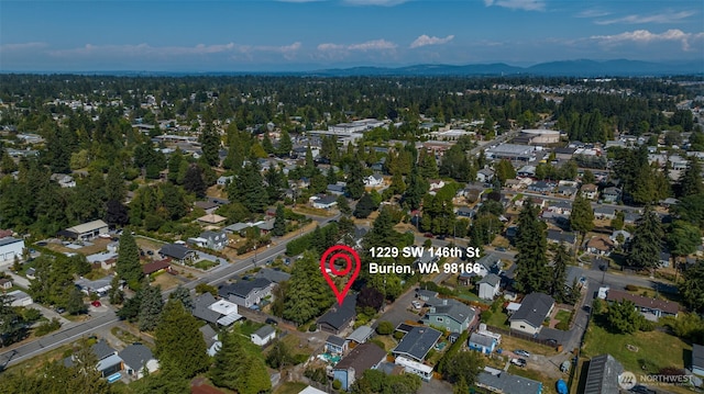 1229 SW 146th, Seahurst, WA 98168 - aerial overview of property's location with nearby suburban area and a mountain backdrop