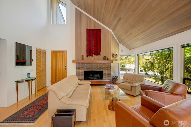 2314 140th Pl SE, Mill Creek, WA 98012 - living room with high vaulted ceiling, healthy amount of natural light, wood finished floors, wooden ceiling, and a brick fireplace