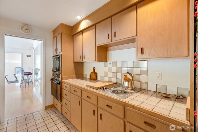 2314 140th Pl SE, Mill Creek, WA 98012 - kitchen featuring tile countertops, appliances with stainless steel finishes, light brown cabinetry, and backsplash