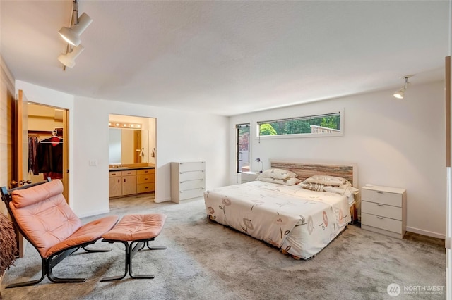 2314 140th Pl SE, Mill Creek, WA 98012 - bedroom with light carpet, a spacious closet, ensuite bathroom, and rail lighting