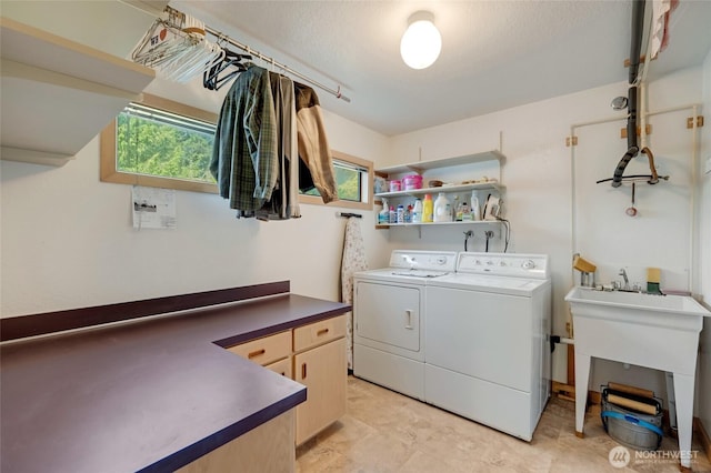 2314 140th Pl SE, Mill Creek, WA 98012 - laundry room with separate washer and dryer, cabinet space, plenty of natural light, and a textured ceiling