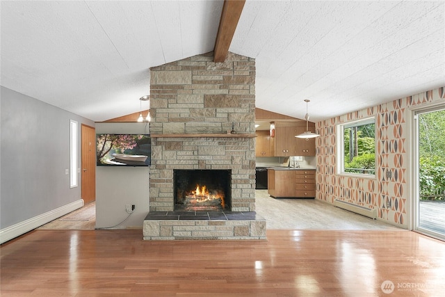 4211 Leavelle St NW, Olympia, WA 98502 - unfurnished living room with a baseboard heating unit, light wood-style flooring, and a fireplace