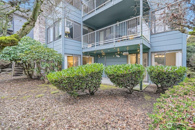 3434 25th Ave W Unit 101, Seattle, WA 98199 - rear view of property with a balcony
