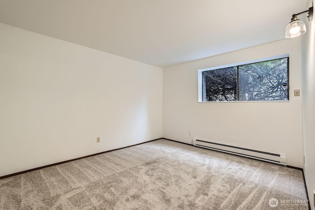 3434 25th Ave W Unit 101, Seattle, WA 98199 - carpeted spare room featuring a baseboard radiator and baseboards