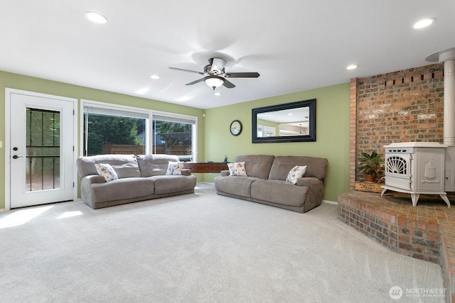 30308 104th Ave, Auburn, WA 98092 - living room featuring a wood stove, carpet, a ceiling fan, and recessed lighting