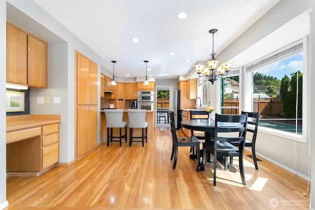 30308 104th Ave, Auburn, WA 98092 - dining space with light wood-type flooring, recessed lighting, and a chandelier