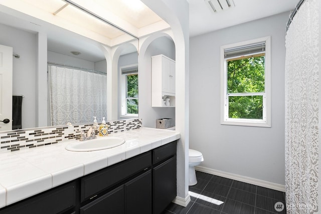 30308 104th Ave, Auburn, WA 98092 - full bath with vanity, plenty of natural light, backsplash, and tile patterned floors