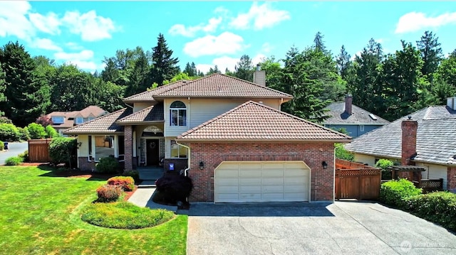 30308 104th Ave, Auburn, WA 98092 - view of front of house with a tile roof, an attached garage, a chimney, asphalt driveway, and brick siding