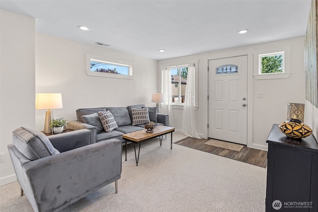 1040 S Director St Unit A, Seattle, WA 98108 - living area featuring healthy amount of natural light, wood finished floors, and recessed lighting