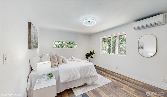 5169 Banner Rd SE, Port Orchard, WA 98367 - bedroom featuring a wall unit AC and wood finished floors