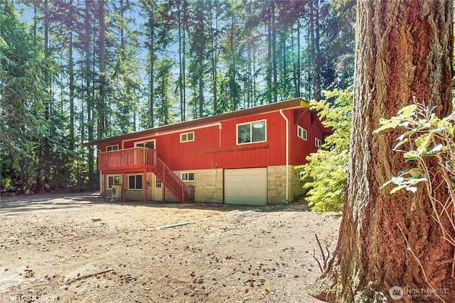 5169 Banner Rd SE, Port Orchard, WA 98367 - view of front of home featuring stairway, dirt driveway, and a deck