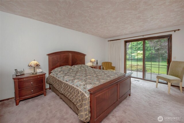 213 Monte Elma Rd, Montesano, WA 98563 - bedroom featuring light carpet, access to outside, and a textured ceiling