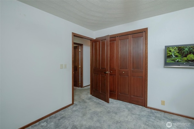 213 Monte Elma Rd, Montesano, WA 98563 - unfurnished bedroom featuring light colored carpet and a closet