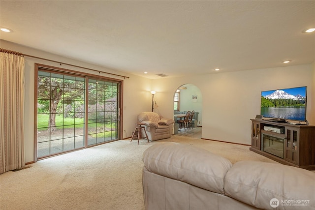 213 Monte Elma Rd, Montesano, WA 98563 - living area with arched walkways, carpet flooring, and recessed lighting