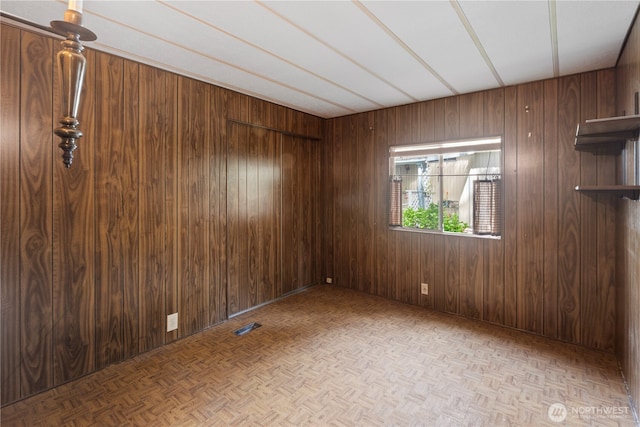 4915 Samish Unit 66, Bellingham, WA 98229 - spare room featuring wood walls