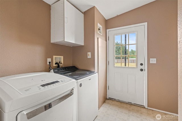 172 Equine Dr, Onalaska, WA 98570 - washroom featuring washer and clothes dryer, cabinet space, and light floors