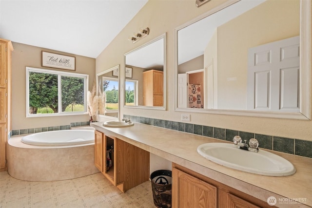 172 Equine Dr, Onalaska, WA 98570 - bathroom with double vanity, a garden tub, and lofted ceiling