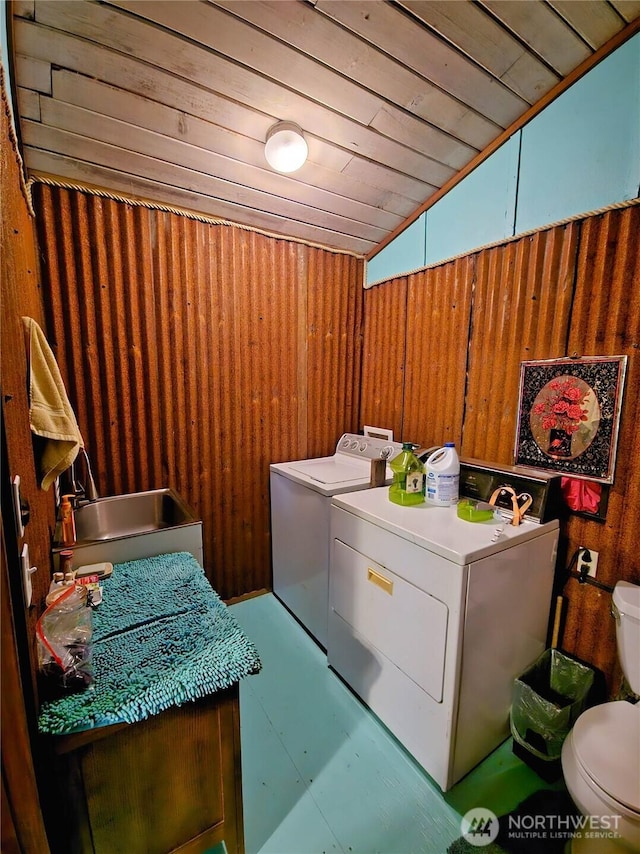 752 Parpala, Naselle, WA 98638 - laundry area featuring wood walls, washer and dryer, and wooden ceiling