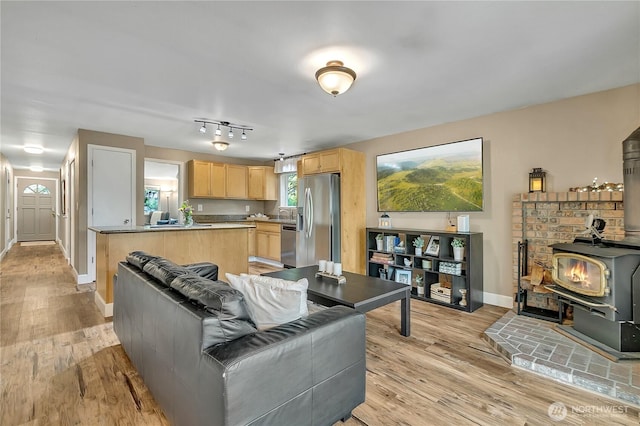 21628 SE 271st St, Maple Valley, WA 98038 - living area with a wood stove and light wood finished floors