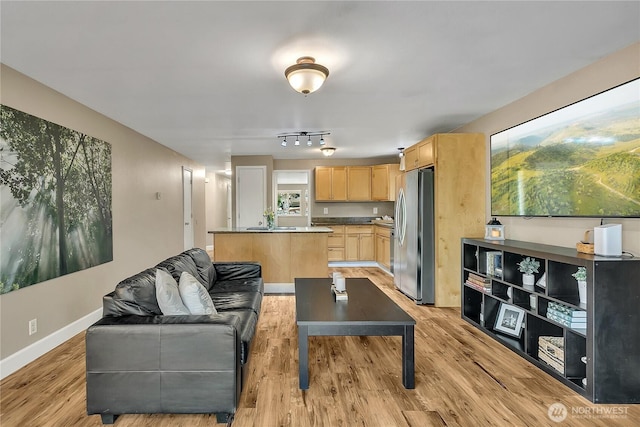21628 SE 271st St, Maple Valley, WA 98038 - living room featuring light wood finished floors and baseboards