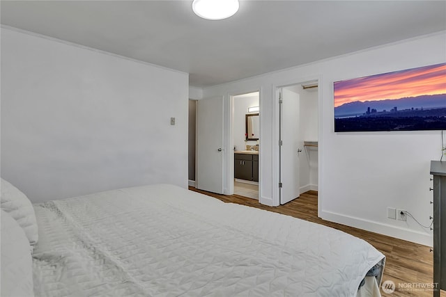 21628 SE 271st St, Maple Valley, WA 98038 - bedroom with wood finished floors and ensuite bathroom