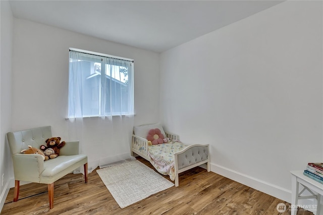 21628 SE 271st St, Maple Valley, WA 98038 - bedroom featuring wood finished floors and baseboards
