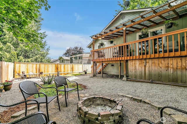 21628 SE 271st St, Maple Valley, WA 98038 - fenced backyard featuring an outdoor fire pit, stairway, a wooden deck, and a patio area