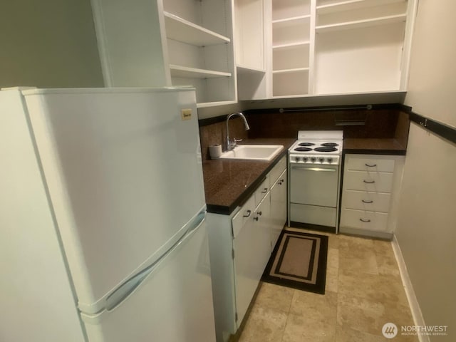 4725 15th Ave NE Unit 14, Seattle, WA 98105 - kitchen with white appliances, white cabinets, dark countertops, and open shelves