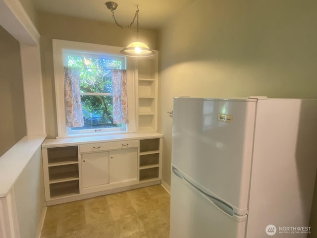 4725 15th Ave NE Unit 14, Seattle, WA 98105 - kitchen with freestanding refrigerator, open shelves, white cabinets, and light countertops