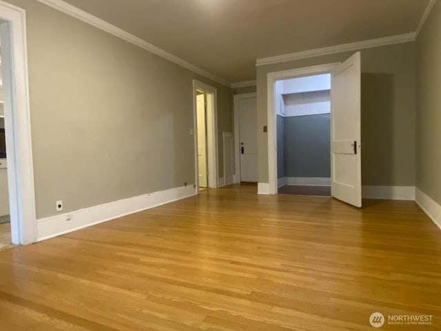 4725 15th Ave NE Unit 14, Seattle, WA 98105 - spare room with light wood-style floors and crown molding