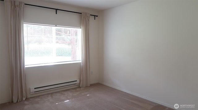 6121 Hazel Ave SE Unit A4, Auburn, WA 98092 - carpeted spare room featuring a baseboard heating unit and baseboards