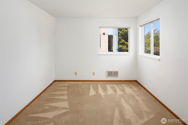 1312 S Massachusetts St Unit 202, Seattle, WA 98144 - spare room featuring light colored carpet and baseboards