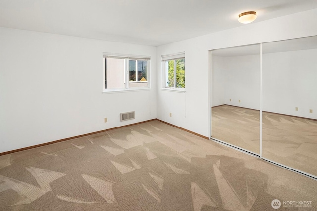 1312 S Massachusetts St Unit 202, Seattle, WA 98144 - unfurnished bedroom featuring carpet and a closet
