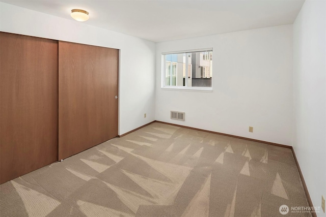 1312 S Massachusetts St Unit 202, Seattle, WA 98144 - unfurnished bedroom with light colored carpet and a closet
