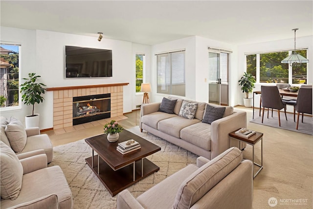 1312 S Massachusetts St Unit 202, Seattle, WA 98144 - living room featuring a tile fireplace